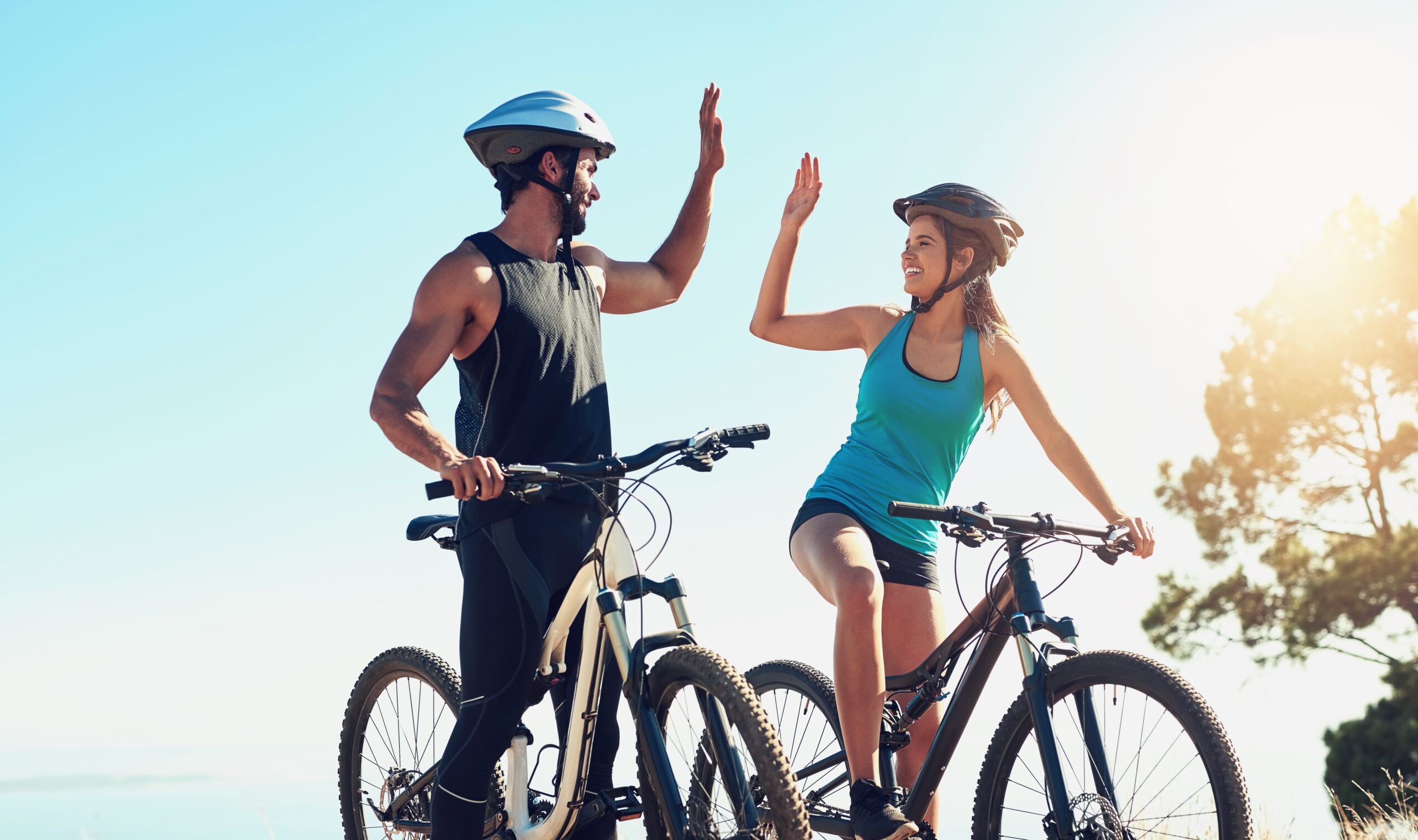 Man,,Woman,Or,Together,On,Bicycle,With,High,Five,In